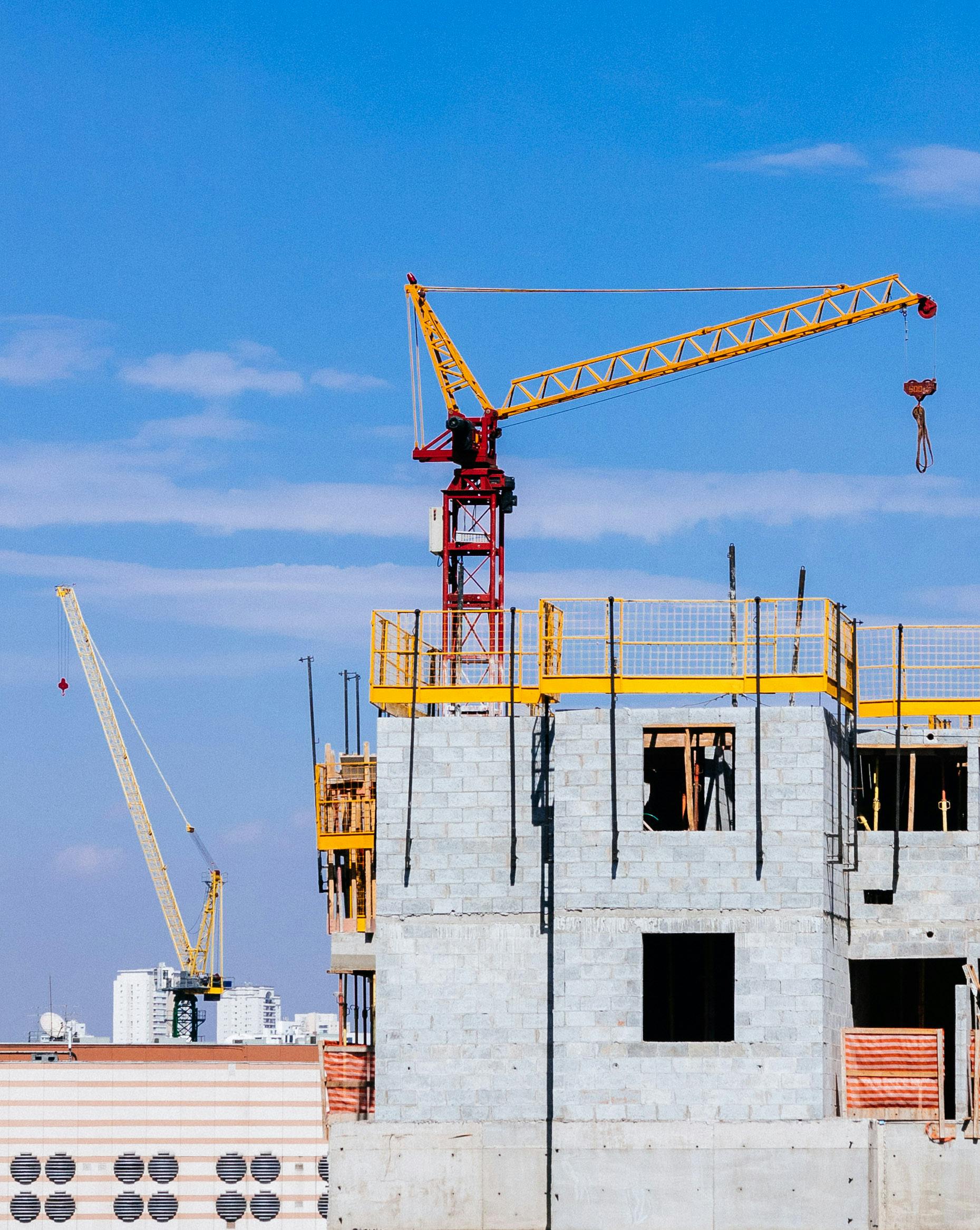 seven construction workers standing on white field
